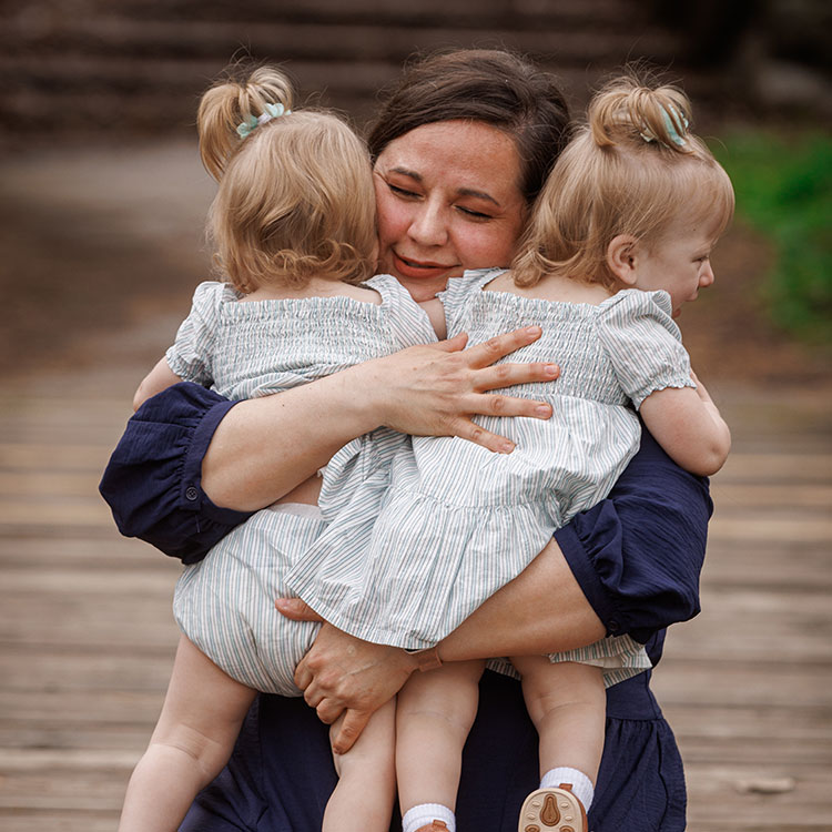 Foster Parent hugging twins
